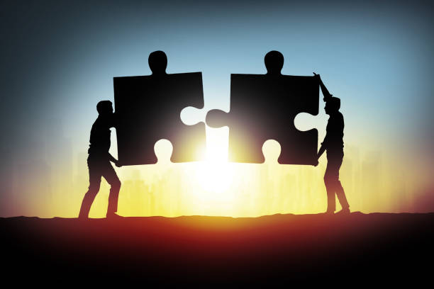 istock businessman connecting jigsaw puzzle pieces 855113660