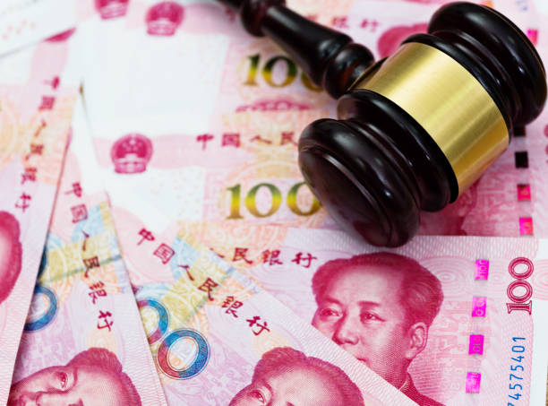 istock Group of Chinese yuan note and gavel 855121316