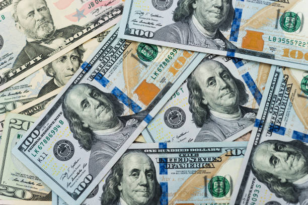 istock Group of dollar bills background 855121716