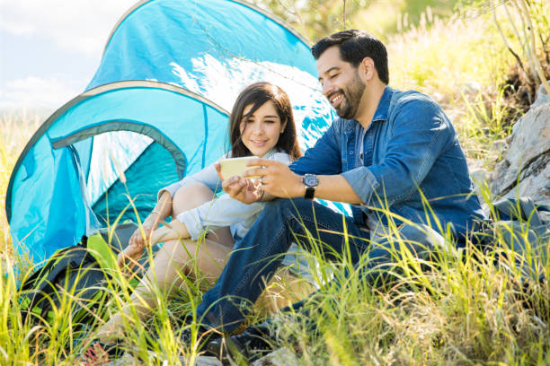 istock Young couple resting after a hike 855124248