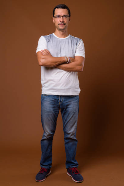 istock Studio shot of handsome man wearing eyeglasses against colored background 855124382