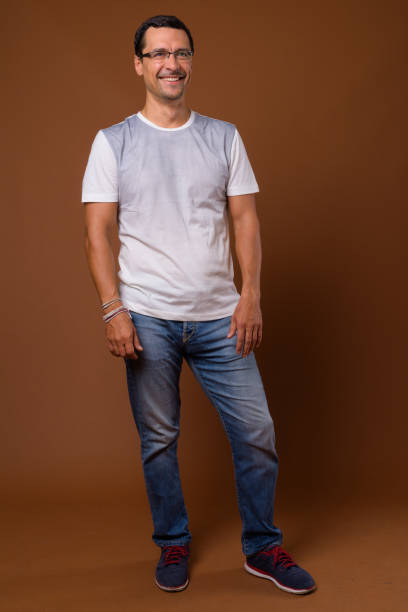 istock Studio shot of handsome man wearing eyeglasses against colored background 855124622