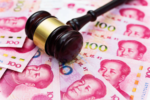 Group of Chinese yuan note and gavel