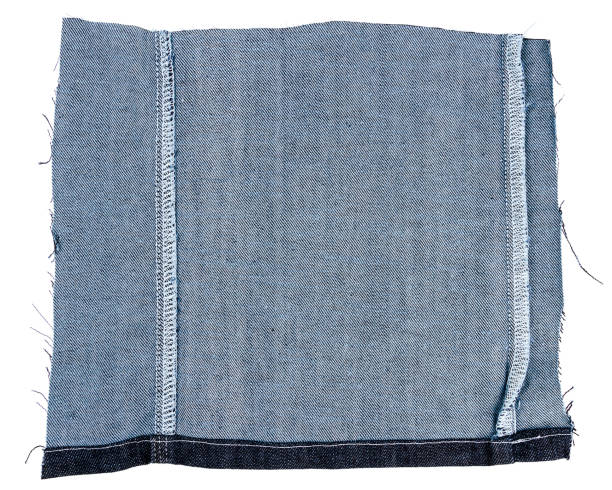 istock Piece of blue jeans fabric 855127888