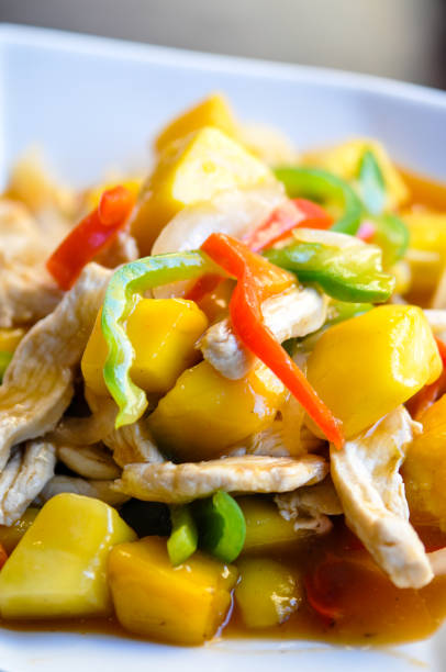 istock Stir-Fried Mango Chicken, Stir-fried chicken with fresh mango, bell pepper, onion in sweet and sour sauce. 855128132