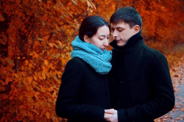 Multi-ethnic couple. Handsome young people. Portrait outdoors, autumn