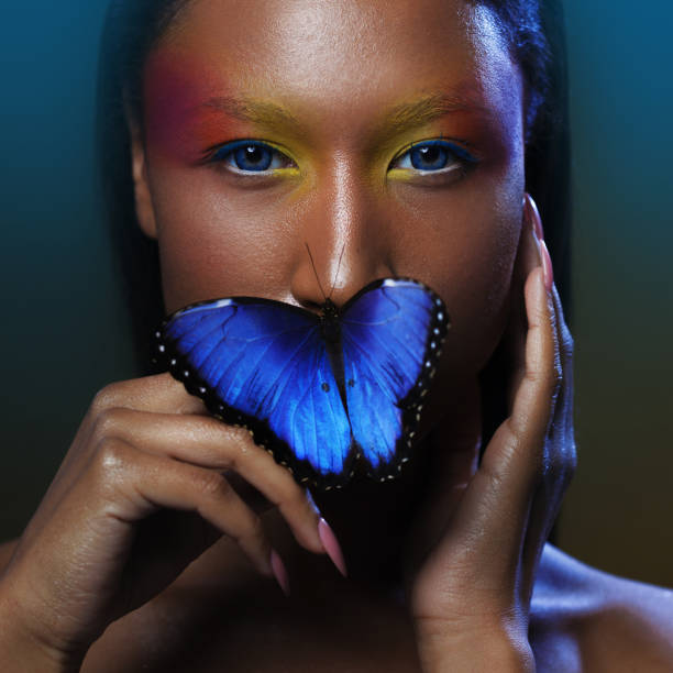 istock Butterfly on the lips, Young and beautiful black model exotic look 855130930