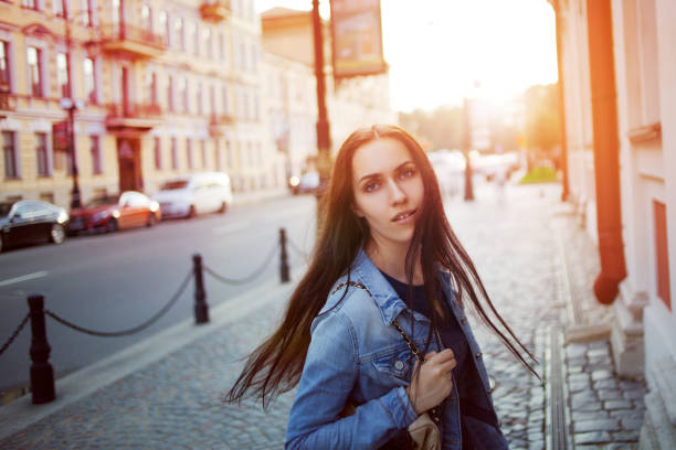 istock Beautiful young brunette with a backpack in the city 855135138