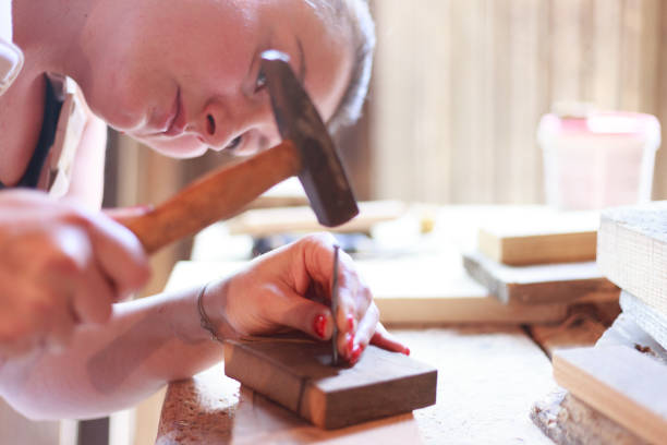 joinery Female carpenter at work - 
 ingenieur stock pictures, royalty-free photos & images