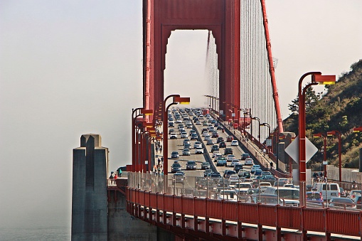 Dense fog rolling over the Golden Gate Bridge.