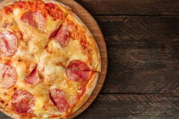 istock Cut pepperoni pizza with a place for text 855141208
