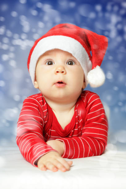 Baby on New Year snow sky background