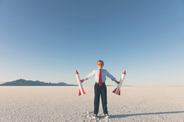 istock Business Boy Holding Rockets 855153252