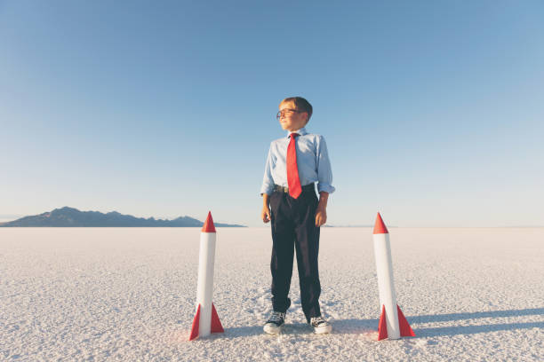 istock Business Boy Holding Rockets 855153254