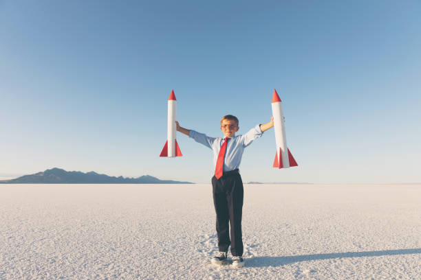istock Business Boy Holding Rockets 855153258