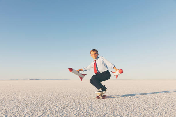 Business Boy Holding Rockets on Skateboard
