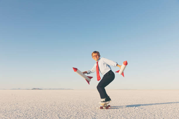 istock Business Boy Holding Rockets on Skateboard 855153278