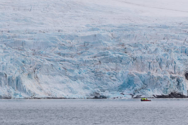 istock Tourists admiring Nordenskiold glacier in Svalbard 855153396