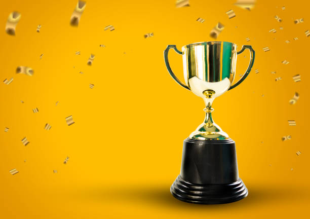 istock gold cup on background concept celebration design Golden confetti 855153888
