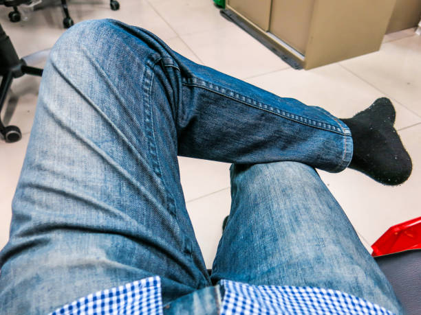 istock Put on Scottish Jeans, sit on legs in relaxed position. 855154404
