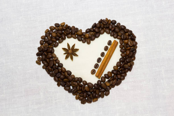 Red heart on coffee. Coffee beans and drinded coffee.