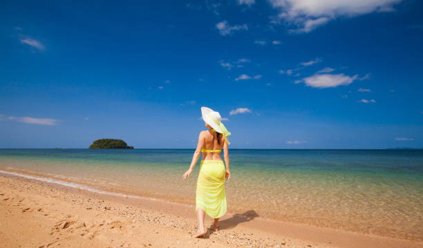istock Thailand. Woman sea, bikini, hat, tan. Libong 855156082