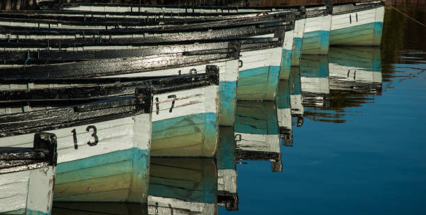 Rowing boats tethered ready for a days fishing. stock photo