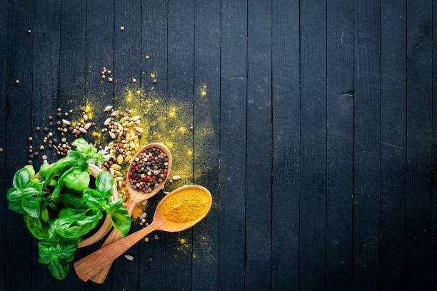 istock Various spices spoons on stone table. On a wooden board. Top view. Free space for your text. 855172594