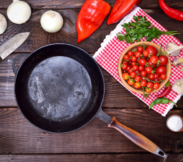 istock empty black cast-iron frying pan with a wooden handle 855180518