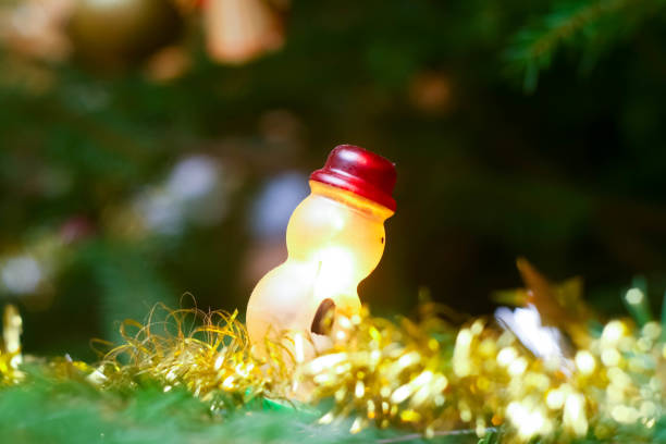 Photo of christmas tree in evening with lights on stock photo