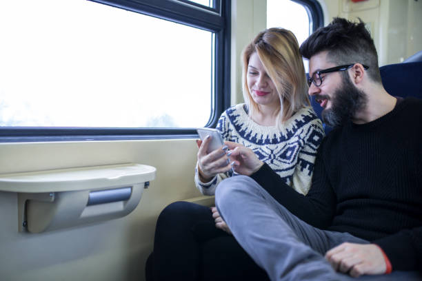 istock Happy couple traveling by train 855180672