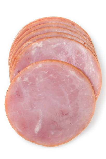 Sliced Canadian Bacon Sliced Canadian Bacon on white background from above canadian culture stock pictures, royalty-free photos & images
