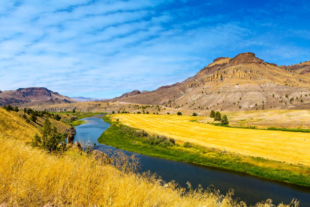 John Day River in Central Oregon on a cloudy blue sky sunny day panoramic view