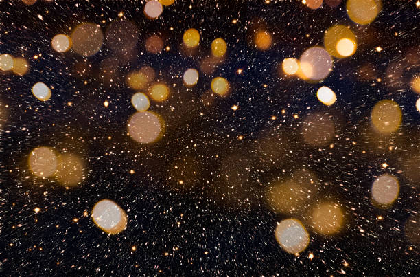 Christmas or New Year golden background Christmas or New Year celebration background with golden glitter explosion and bokeh party photo backdrop stock pictures, royalty-free photos & images
