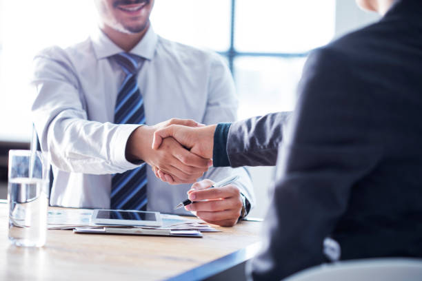 Business handshake in the office stock photo