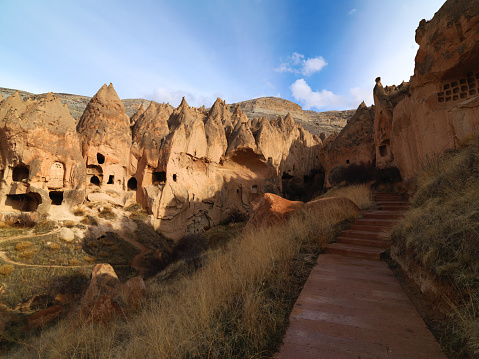 Fairy Chimneys in Zelve Valley at Cappadocia, Turkey. This region where the soft strata formed by lava and ashes, were eroded by rain and wind for 60 millions of years. Here in Zelve Valley, the Christians and Muslims lived together in perfect harmony, until 1924. Then Christians had to leave the Valley because of the exchange of minorities between Greece and Turkey, and the Muslims were forced to evacuate the Valley in the 50's when life became dangerous due to risk of erosion.