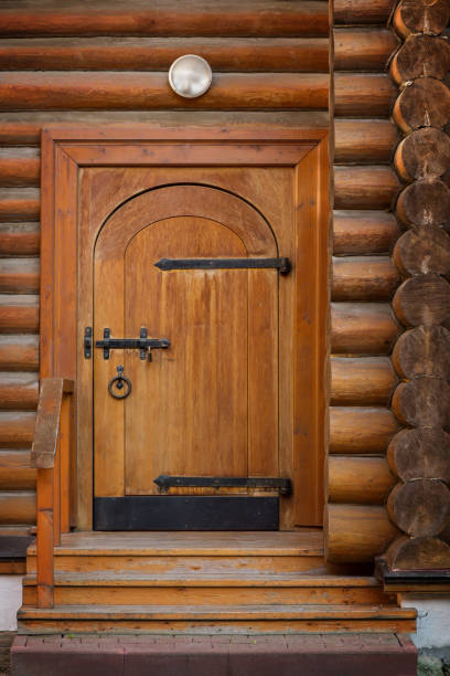 istock Old wooden door with a bolt and a lock 855201434