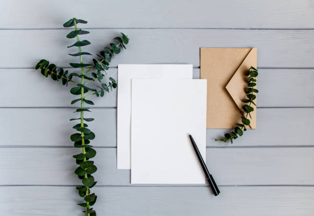 istock Letter, envelope and eucalyptus branches on grey background. Invitation card, or love letter. Top view, flat lay 855202018