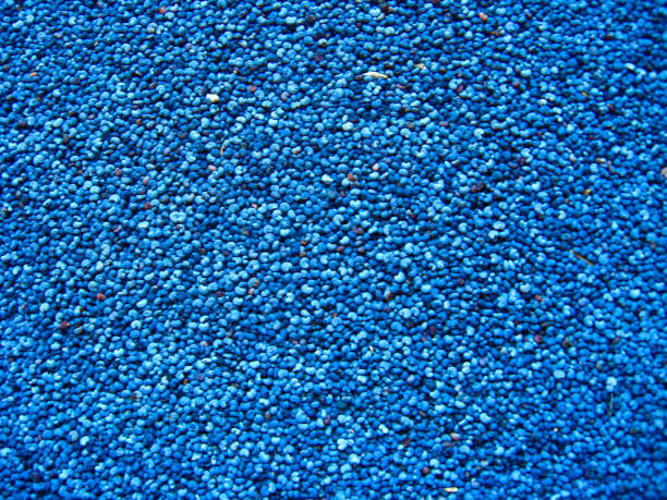 istock blue background from grains of a poppy 855205130