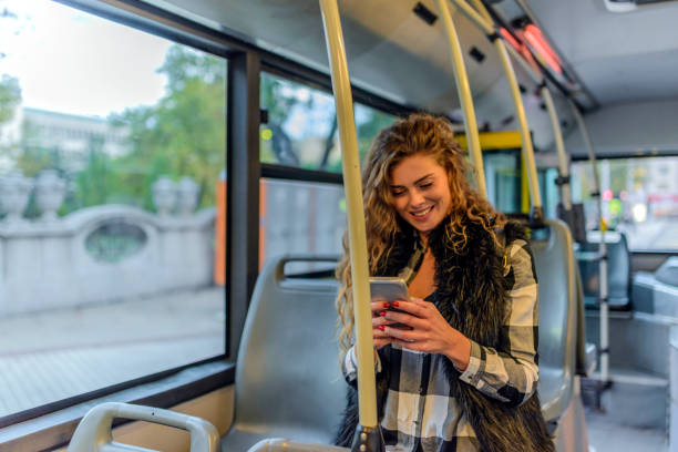 istock Young Woman Typing On Her Smart Phone In Public Transportation. 855205530