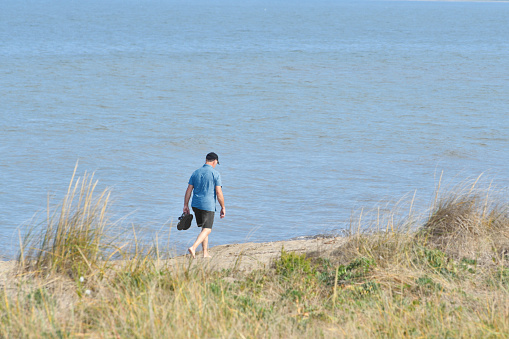 Man Walking on Beach (New Brunswick Canada)