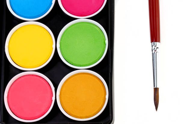 istock paints of different colors and slim paintbrush (brush) 855217924