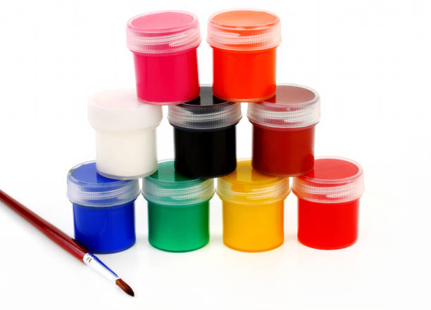 istock paints of different colors and slim paintbrush (brush) 855218020