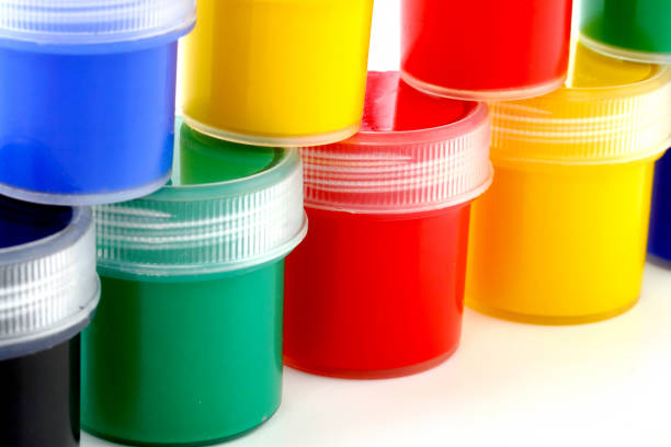 istock paints of different colors and slim paintbrush (brush) 855218102