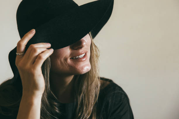 istock Young woman in a hat smiling 855233384