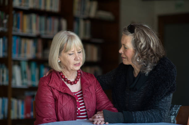 istock Two senior ladies supporting and listening 855233462