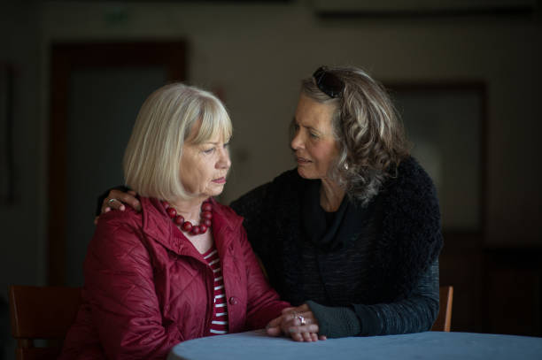 istock Two senior ladies supporting and listening 855235564