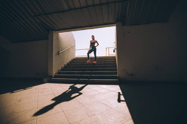 istock Woman athlete on stadium entrance 855236666