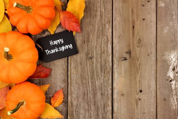 istock Happy Thanksgiving chalkboard tag with autumn side border over wood 855242628