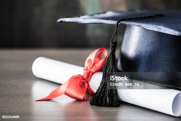 Graduation Hat And Diploma On Table Stock Photo - Download Image Now - Diploma, Graduation, University